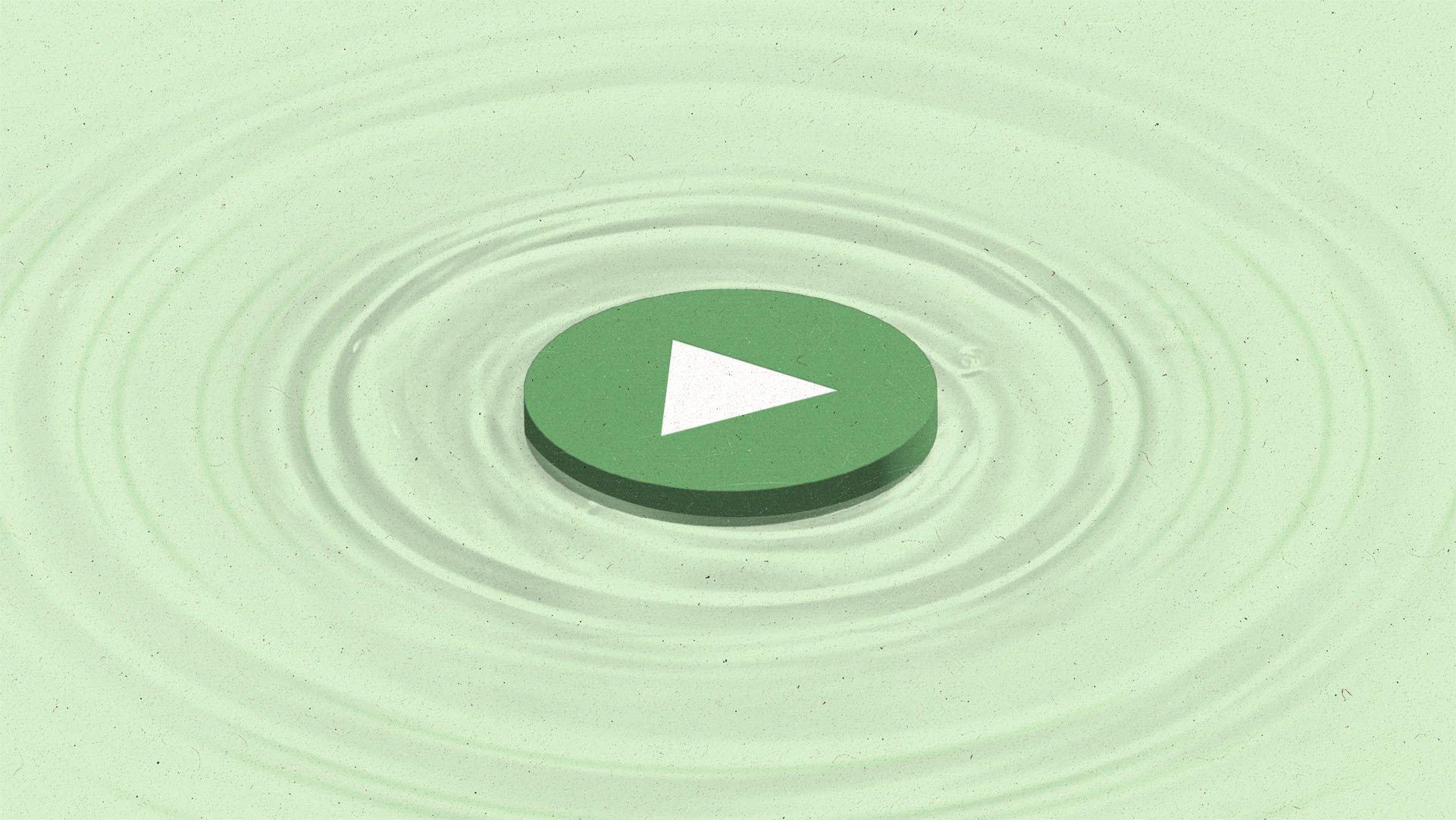 a green play button lilypad sits flat atop water creating concentric ripples.
