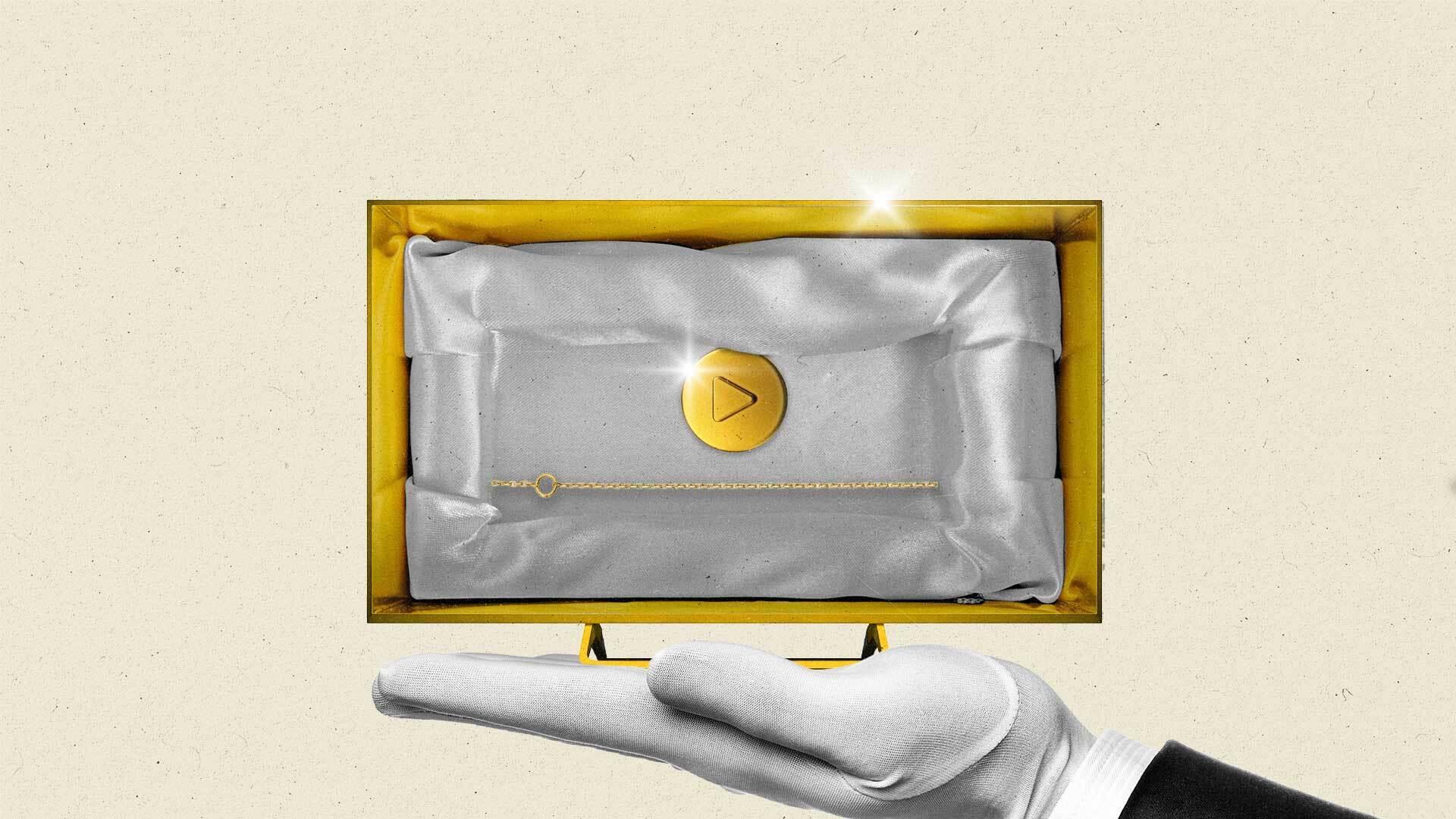 A hand with a white linen glove balances a golden CTV with a gold chain progress bar and a gold play button inset in satin.