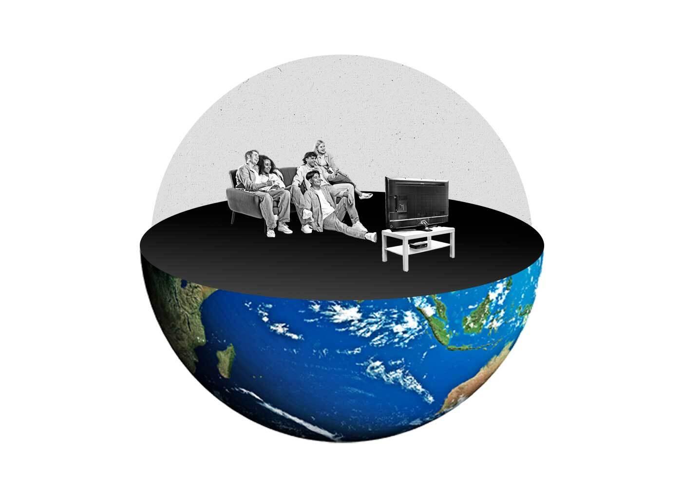 Globe split in half with people on a couch watching TV sitting on top of the globe.