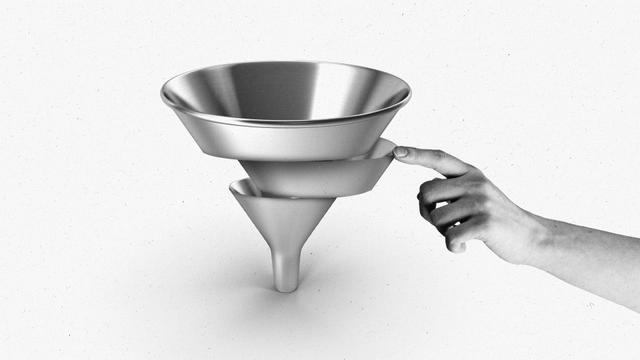 A hand pushing the center of a funnel back into place.