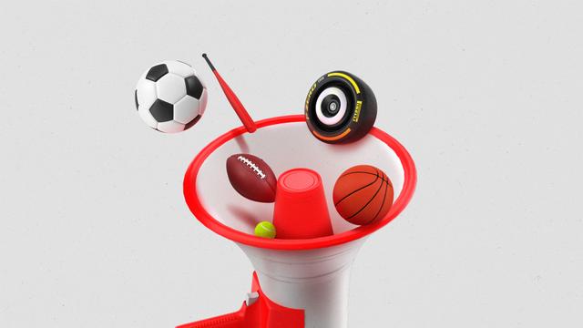 Sports balls and equipment including a football, Formula1 racing tire, soccer ball and basketball, flying out of a large megaphone.